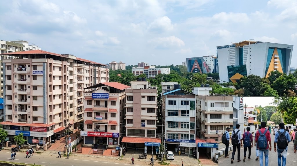 Students walking near modern hostels near Infopark Kakkanad and city buildings.